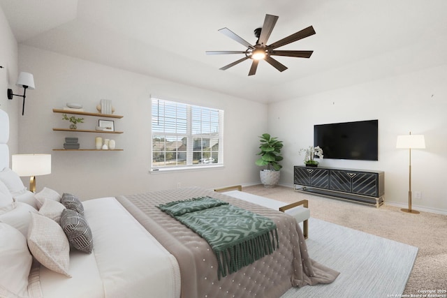 bedroom with ceiling fan, carpet, and baseboards