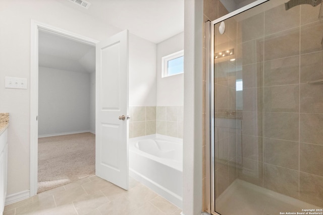 full bath with a stall shower, vanity, a garden tub, and tile patterned floors