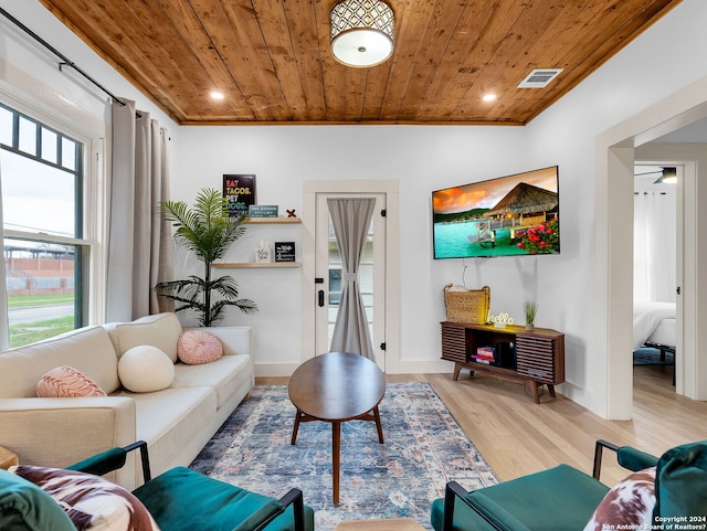 living area with light wood finished floors, wood ceiling, visible vents, and recessed lighting