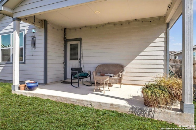 view of patio / terrace featuring fence