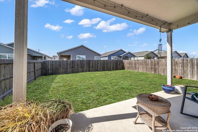 view of yard with a fenced backyard and a patio