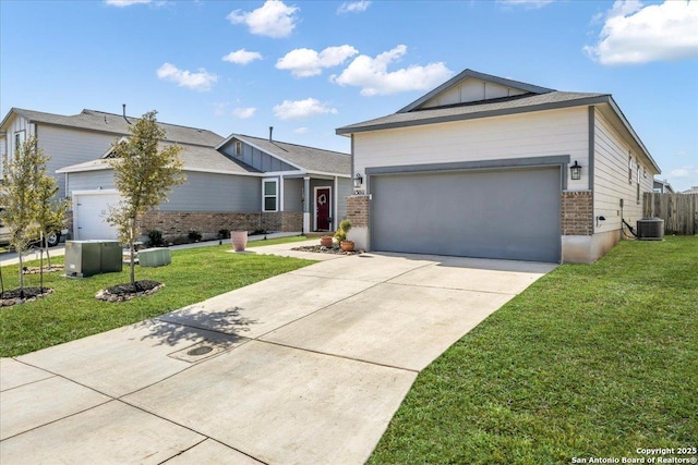 ranch-style home with board and batten siding, a front yard, brick siding, and an attached garage