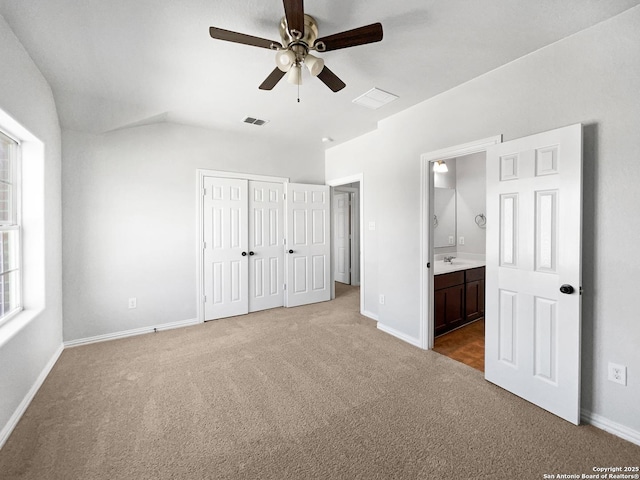 12518 Ponder, San Antonio, TX 78245 - unfurnished bedroom with visible vents, baseboards, ensuite bathroom, and carpet flooring