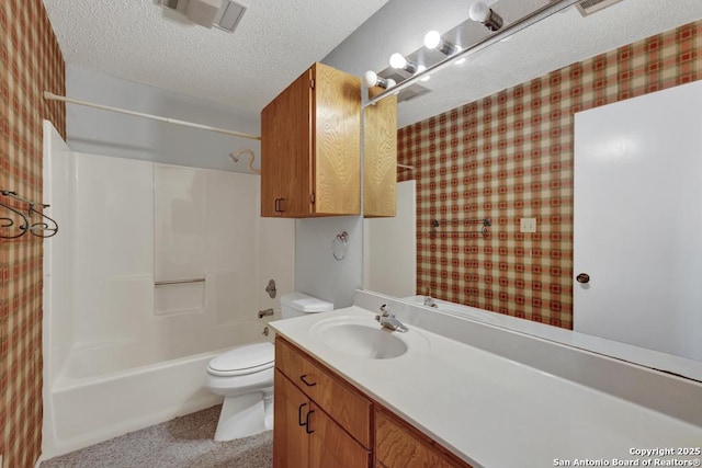 bathroom featuring wallpapered walls, toilet, a textured ceiling, vanity, and washtub / shower combination