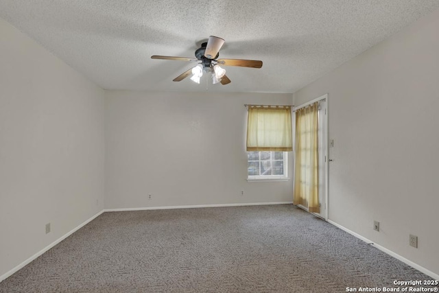 carpeted empty room with a textured ceiling, baseboards, and a ceiling fan