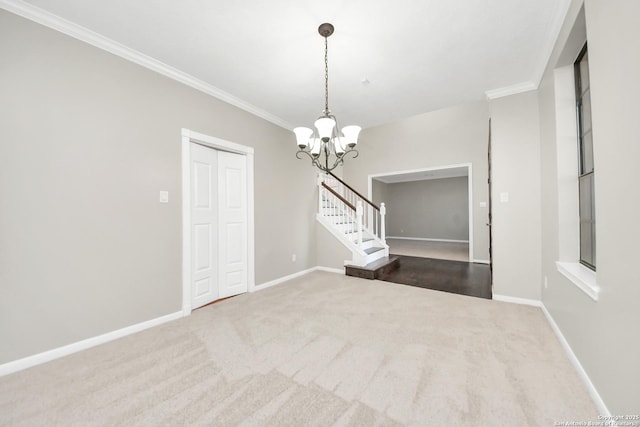 unfurnished room with ornamental molding, carpet flooring, a chandelier, baseboards, and stairs