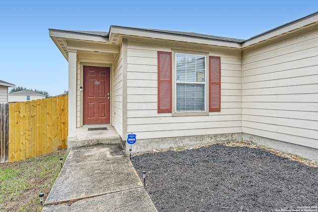 property entrance featuring fence