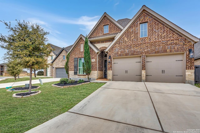 view of front of home featuring a garage, concrete driveway, stone siding, a front lawn, and brick siding