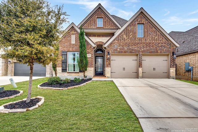 view of front of house with an attached garage, brick siding, concrete driveway, roof with shingles, and a front yard