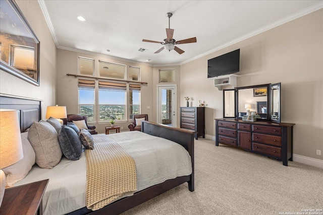 bedroom with light carpet, a ceiling fan, baseboards, visible vents, and crown molding