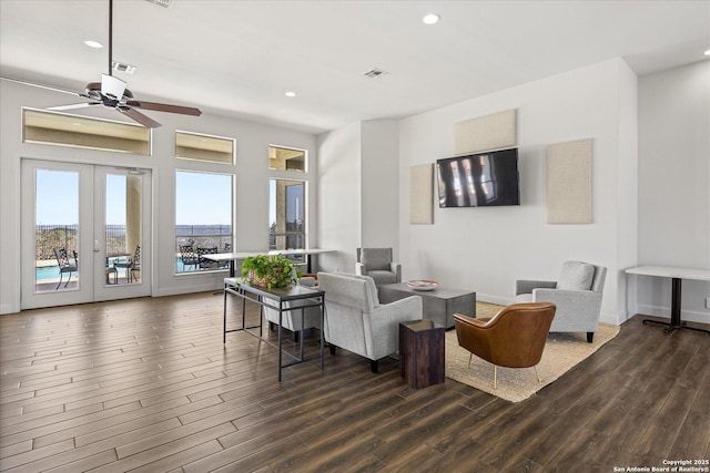 living area featuring french doors, wood finished floors, visible vents, and recessed lighting