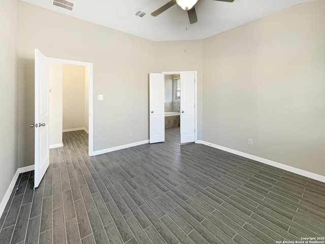 unfurnished bedroom featuring dark wood-type flooring, visible vents, and baseboards