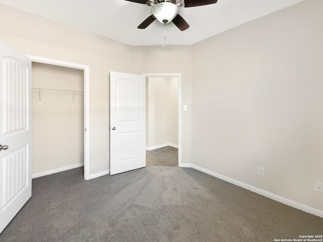 unfurnished bedroom with ceiling fan, a closet, carpet, and baseboards