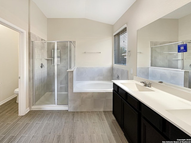 full bathroom with a stall shower, a sink, lofted ceiling, and wood tiled floor