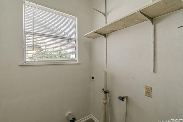 clothes washing area featuring laundry area and hookup for an electric dryer