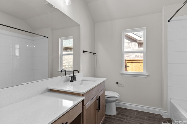 bathroom with toilet, wood finished floors, walk in shower, vaulted ceiling, and vanity