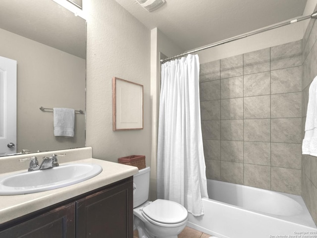 full bathroom featuring toilet, tile patterned floors, shower / bath combination with curtain, and vanity