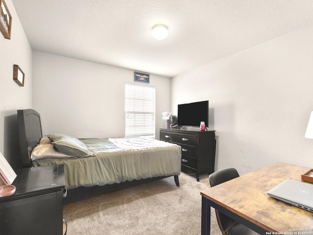 bedroom featuring light colored carpet