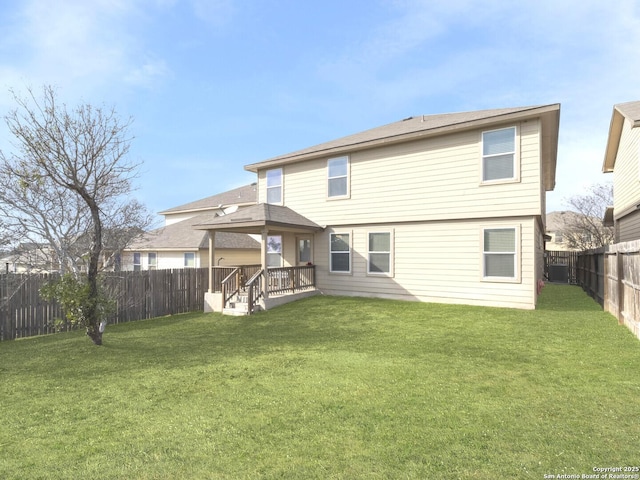 rear view of house featuring a fenced backyard, a lawn, and central AC unit