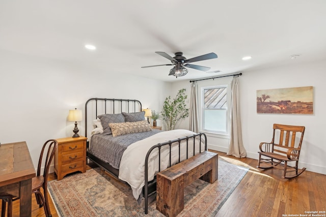 bedroom featuring recessed lighting, visible vents, ceiling fan, wood finished floors, and baseboards