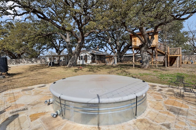 view of patio / terrace featuring a fenced backyard and stairs