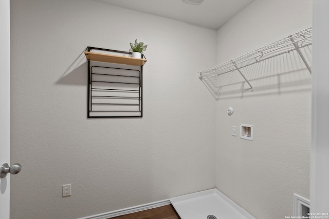 laundry room featuring laundry area, hookup for a washing machine, and baseboards