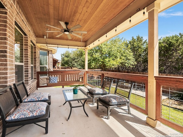 view of patio featuring fence and ceiling fan