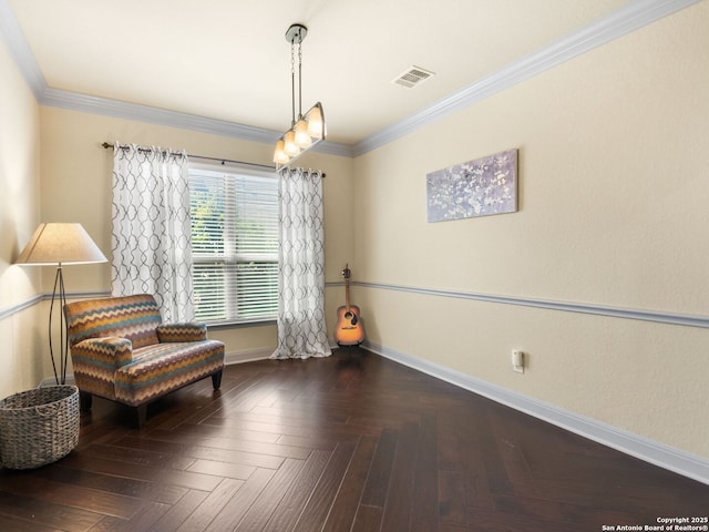 sitting room featuring visible vents, baseboards, and crown molding