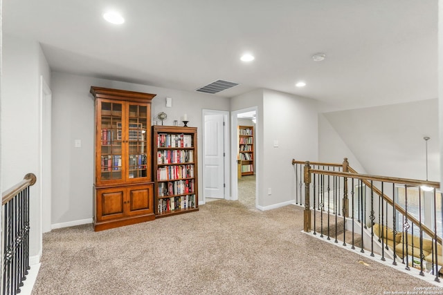 hall with visible vents, carpet flooring, an upstairs landing, and recessed lighting