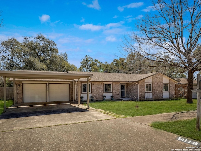 ranch-style house with an attached garage, brick siding, aphalt driveway, and a front yard