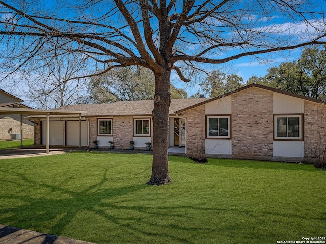 view of front facade featuring a garage, brick siding, a shingled roof, concrete driveway, and a front yard