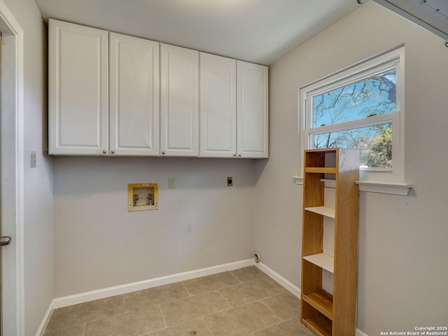 laundry area featuring hookup for a washing machine, hookup for an electric dryer, cabinet space, and baseboards