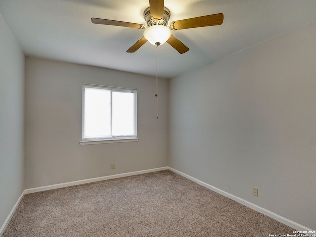 carpeted empty room with baseboards