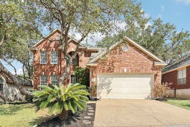 traditional home featuring concrete driveway, brick siding, and an attached garage