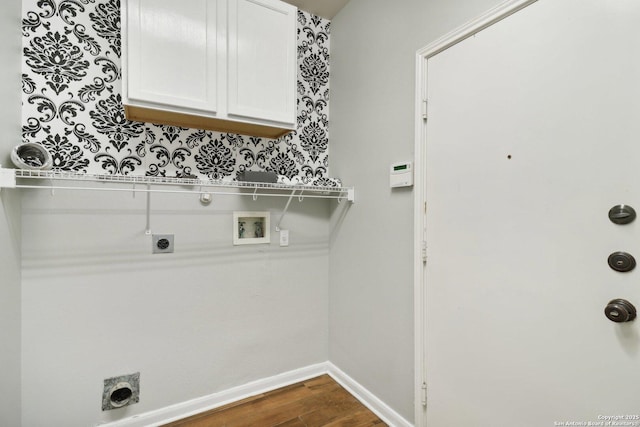 laundry room featuring dark wood-style floors, washer hookup, cabinet space, hookup for an electric dryer, and baseboards