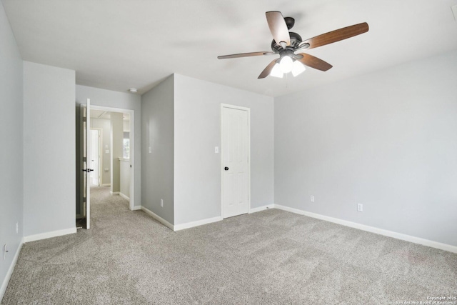 unfurnished bedroom featuring carpet floors, ceiling fan, and baseboards