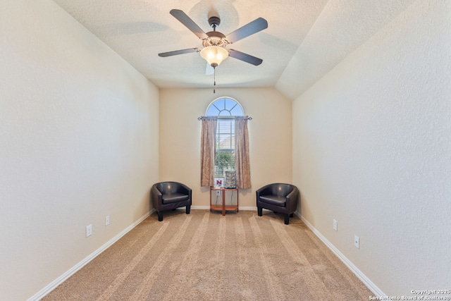 unfurnished room featuring ceiling fan, baseboards, a textured ceiling, and light colored carpet