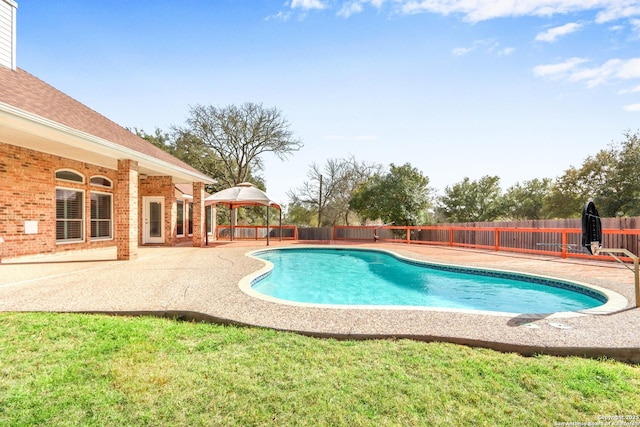 view of pool featuring a fenced in pool, a fenced backyard, a gazebo, a yard, and a patio area