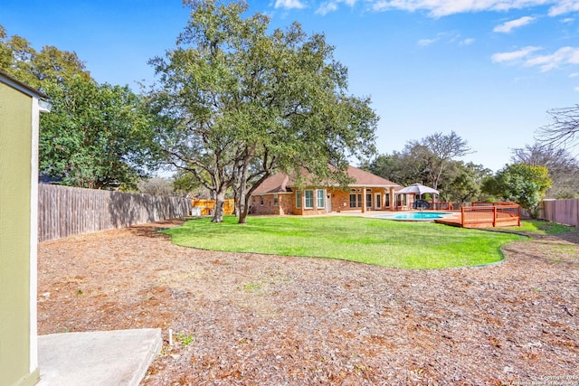 view of yard with a fenced backyard and a fenced in pool