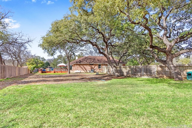 view of yard featuring a fenced backyard