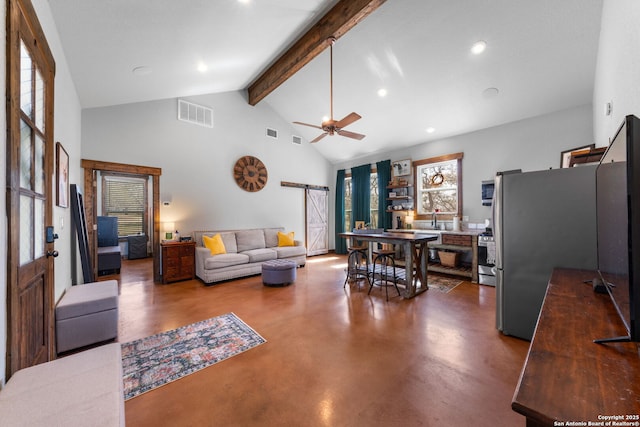 living room featuring high vaulted ceiling, a barn door, visible vents, beam ceiling, and finished concrete floors