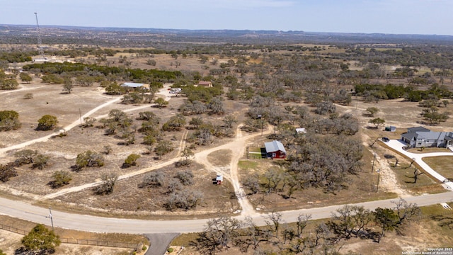 birds eye view of property with a rural view