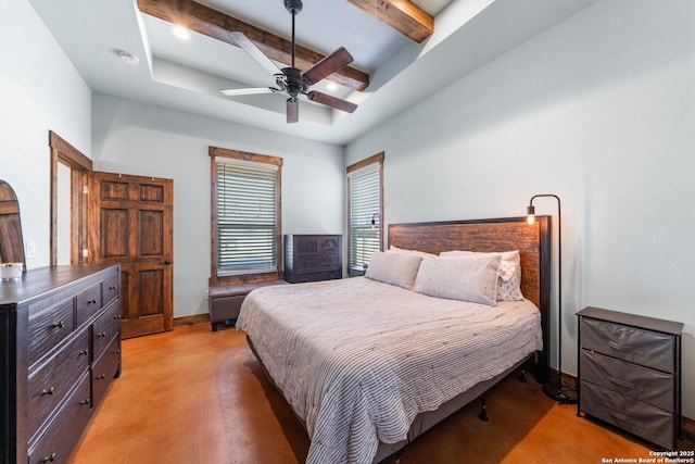 bedroom with a ceiling fan, a tray ceiling, baseboards, and beamed ceiling