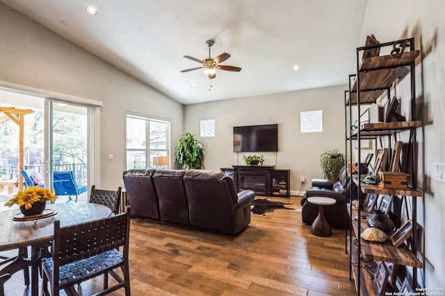 living room with lofted ceiling, recessed lighting, a ceiling fan, baseboards, and hardwood / wood-style flooring