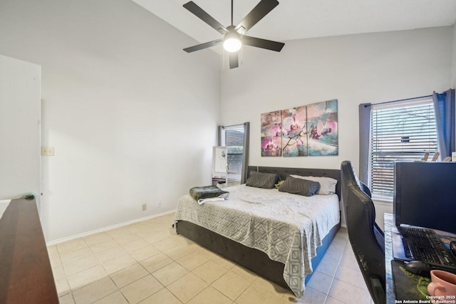 bedroom with high vaulted ceiling, light tile patterned flooring, baseboards, and a ceiling fan