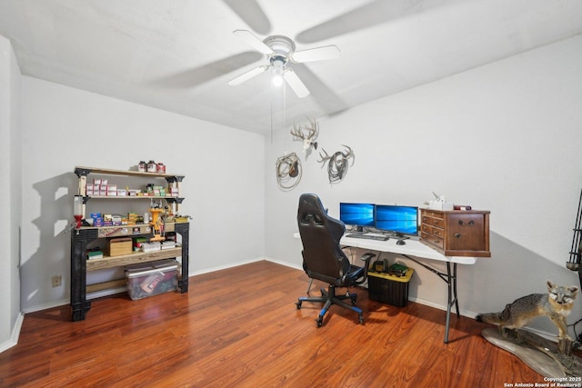 home office featuring ceiling fan, wood finished floors, and baseboards