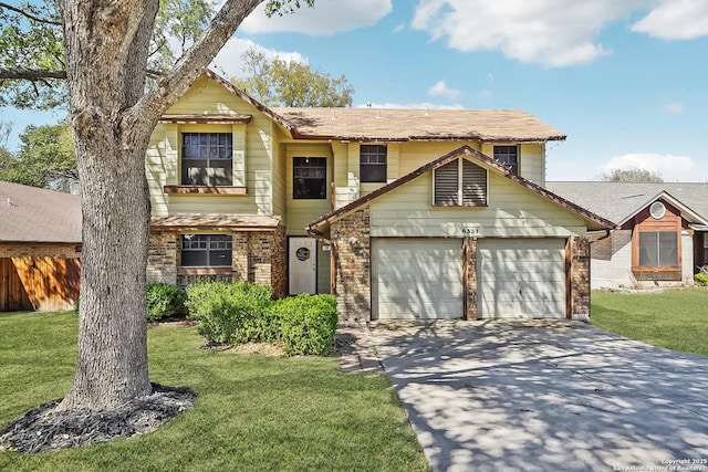 traditional-style house featuring driveway, brick siding, an attached garage, and a front yard