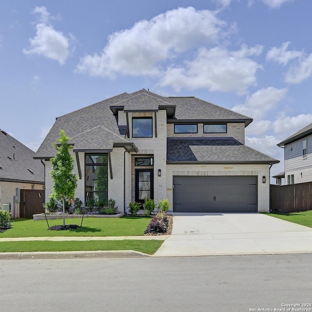 view of front of property featuring driveway, an attached garage, roof with shingles, and brick siding