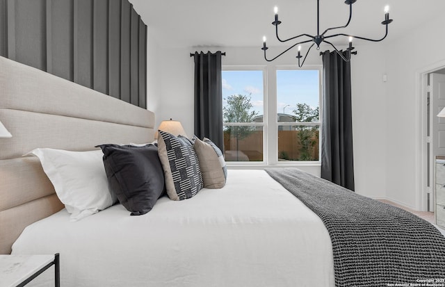 bedroom featuring an inviting chandelier