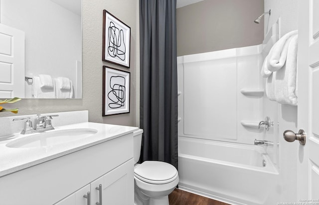 full bath with shower / bath combo with shower curtain, vanity, toilet, and wood finished floors